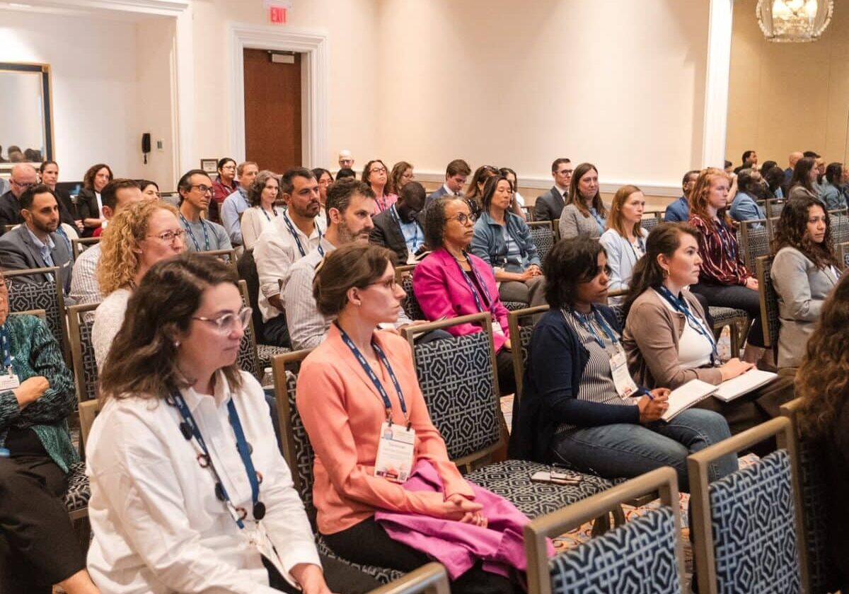 Large audience of seated conference attendees